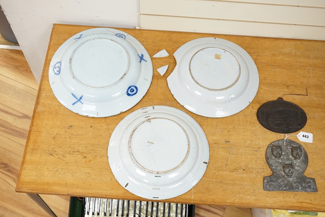 An 18th century English delftware ‘Chinese figures’ dish and two similar Delft dishes, largest 39cm diameter (3), largest 39cm